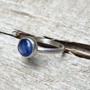 Shop Kyanite Rings! Minimalist Elegant Blue Pearlized Kyanite 8mm Round Solitaire Sterling Silver Ring | Blue Gemstone Ring | Kyanite Ring | Silver Ring | Natural genuine Kyanite rings, simple unique handcrafted gemstone rings. #rings #jewelry #shopping #gift #handmade #fashion #style #affiliate #ad