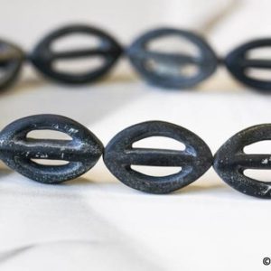 Shop Obsidian Bead Shapes! L/ Matte Black Obsidian 16-19x mm Marquise Donut Beads 15" Strand 13pcs Natural Ink Black Obsidian Stone Fancy Carved Oval Donut For Jewelry | Natural genuine other-shape Obsidian beads for beading and jewelry making.  #jewelry #beads #beadedjewelry #diyjewelry #jewelrymaking #beadstore #beading #affiliate #ad