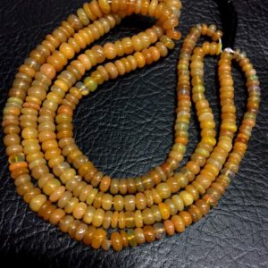 Shop Opal Rondelle Beads! Natural Smooth Ethiopian Opal Rondelle Shape Beads 5-6mm Loose Gemstone Beads 16" Strand Top Quality New Arrival | Natural genuine rondelle Opal beads for beading and jewelry making.  #jewelry #beads #beadedjewelry #diyjewelry #jewelrymaking #beadstore #beading #affiliate #ad