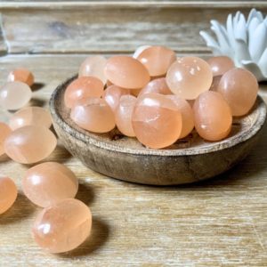 Shop Tumbled Selenite Crystals & Pocket Stones! Peach Selenite Tumbled Stone | Natural genuine stones & crystals in various shapes & sizes. Buy raw cut, tumbled, or polished gemstones for making jewelry or crystal healing energy vibration raising reiki stones. #crystals #gemstones #crystalhealing #crystalsandgemstones #energyhealing #affiliate #ad