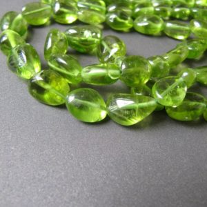 Shop Peridot Chip & Nugget Beads! Peridot Organic Nuggets • 8.50-13mm BIG Chubby Beads • AA+ With INCLUSIONS • Smooth Polish • Natural Freeform Oval Nuggets • Vivid Green | Natural genuine chip Peridot beads for beading and jewelry making.  #jewelry #beads #beadedjewelry #diyjewelry #jewelrymaking #beadstore #beading #affiliate #ad
