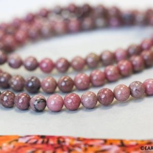 Shop Rhodonite Round Beads! S-M/ Rhodonite 6mm/ 8mm Round beads 15.5" strand Natural pink gemstone beads for jewelry making | Natural genuine round Rhodonite beads for beading and jewelry making.  #jewelry #beads #beadedjewelry #diyjewelry #jewelrymaking #beadstore #beading #affiliate #ad
