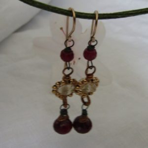 Shop Ruby Earrings! Ruby Briolette, Faceted Golden Rutile Rondelle, 14k Gold Fill Beads, 14k Hook Style Earwire Silver Earrings | Natural genuine Ruby earrings. Buy crystal jewelry, handmade handcrafted artisan jewelry for women.  Unique handmade gift ideas. #jewelry #beadedearrings #beadedjewelry #gift #shopping #handmadejewelry #fashion #style #product #earrings #affiliate #ad