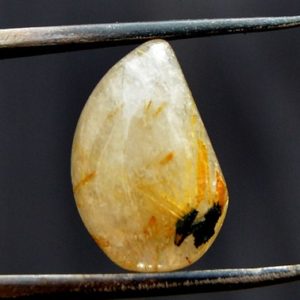 Shop Rutilated Quartz Cabochons! Golden Rutilated Quartz Cabochon Stone (14mm x 10mm x 5mm) 5.5cts – Drop Gemstone – Loose Crystal | Natural genuine stones & crystals in various shapes & sizes. Buy raw cut, tumbled, or polished gemstones for making jewelry or crystal healing energy vibration raising reiki stones. #crystals #gemstones #crystalhealing #crystalsandgemstones #energyhealing #affiliate #ad
