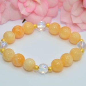 Shop Orange Calcite Jewelry! Solar plexus chakra, bracelet in orange calcite and rock crystal with gold-plated silver elements | Natural genuine Orange Calcite jewelry. Buy crystal jewelry, handmade handcrafted artisan jewelry for women.  Unique handmade gift ideas. #jewelry #beadedjewelry #beadedjewelry #gift #shopping #handmadejewelry #fashion #style #product #jewelry #affiliate #ad