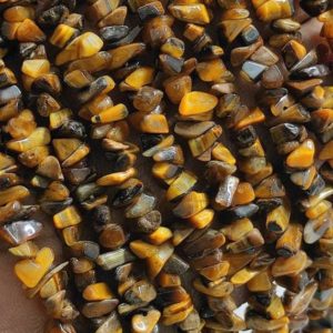 Shop Tiger Eye Chip & Nugget Beads! Natural Yellow Tiger's Eye Raw Uncut Chips Gemstone Beads,Tiger's Eye Raw Rough Uncut Beads,34" Tiger's Eye Chip Beads For Handmade Jewelry | Natural genuine chip Tiger Eye beads for beading and jewelry making.  #jewelry #beads #beadedjewelry #diyjewelry #jewelrymaking #beadstore #beading #affiliate #ad