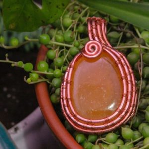 Shop Orange Calcite Jewelry! Wire wrapped, orange calcite and copper wire wrapped pendant one of a kind (NO CHAIN) | Natural genuine Orange Calcite jewelry. Buy crystal jewelry, handmade handcrafted artisan jewelry for women.  Unique handmade gift ideas. #jewelry #beadedjewelry #beadedjewelry #gift #shopping #handmadejewelry #fashion #style #product #jewelry #affiliate #ad