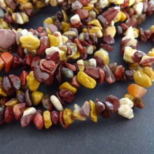 Shop Mookaite Jasper Chip & Nugget Beads! 33 Inch 5-11mm Natural Mookaite Bead Strand, Maroon & Yellow, About 200-300 Polished Drilled Chips, Mookaite Stone Jasper Nugget Beads | Natural genuine chip Mookaite Jasper beads for beading and jewelry making.  #jewelry #beads #beadedjewelry #diyjewelry #jewelrymaking #beadstore #beading #affiliate #ad