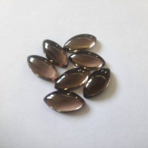 Shop Smoky Quartz Cabochons! AAA Quality Smoky Quartz Cabochon Marquise Shape Gemstone Size 4×8, 5×10, 6×12, 7×14, 8×16, 9×18, 10×20, 11×22, 12x24mm Smoky Jewelry Making | Natural genuine stones & crystals in various shapes & sizes. Buy raw cut, tumbled, or polished gemstones for making jewelry or crystal healing energy vibration raising reiki stones. #crystals #gemstones #crystalhealing #crystalsandgemstones #energyhealing #affiliate #ad