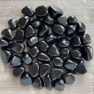 Shop Tumbled Obsidian Crystals & Pocket Stones! Black Obsidian Tumbled Stones, 0.75-1 Inch Tumbled Black Obsidian Stones, Black Obsidian Crystals, Healing Crystals, Wholesale Bulk Lot | Natural genuine stones & crystals in various shapes & sizes. Buy raw cut, tumbled, or polished gemstones for making jewelry or crystal healing energy vibration raising reiki stones. #crystals #gemstones #crystalhealing #crystalsandgemstones #energyhealing #affiliate #ad