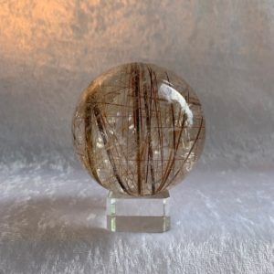 Shop Rutilated Quartz Stones & Crystals! Brilliant Large Super Clear Golden Rutilated Quartz Sphere with Stand | Natural genuine stones & crystals in various shapes & sizes. Buy raw cut, tumbled, or polished gemstones for making jewelry or crystal healing energy vibration raising reiki stones. #crystals #gemstones #crystalhealing #crystalsandgemstones #energyhealing #affiliate #ad