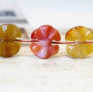 Shop Carnelian Bead Shapes! XL/ Natural Carnelian 18-20x Bows beads 15.5" strand Routinely enhanced Size/Shade varies For jewelry making | Natural genuine other-shape Carnelian beads for beading and jewelry making.  #jewelry #beads #beadedjewelry #diyjewelry #jewelrymaking #beadstore #beading #affiliate #ad