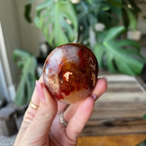 Shop Carnelian Shapes! Carnelian Palm stone from Madagascar | Natural genuine stones & crystals in various shapes & sizes. Buy raw cut, tumbled, or polished gemstones for making jewelry or crystal healing energy vibration raising reiki stones. #crystals #gemstones #crystalhealing #crystalsandgemstones #energyhealing #affiliate #ad