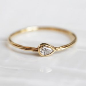 Pear Diamond Ring Delicate Twisted Gold Band, Delicate Engagement Ring 0.1 carat diamond by Threelayers | Natural genuine Gemstone rings, simple unique alternative gemstone engagement rings. #rings #jewelry #bridal #wedding #jewelryaccessories #engagementrings #weddingideas #affiliate #ad