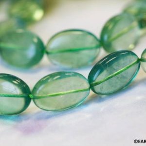 Shop Fluorite Bead Shapes! L/ Green Fluorite 18x25mm Flat Oval beads 15.5" strand Natural green transparent gemstone Shade varies For jewelry making | Natural genuine other-shape Fluorite beads for beading and jewelry making.  #jewelry #beads #beadedjewelry #diyjewelry #jewelrymaking #beadstore #beading #affiliate #ad