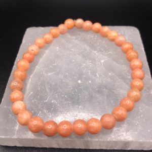 Natural Peach Calcite 6mm Genuine round Stretch Bracelet mens bracelet womans bracelet • compassion • deep love • boost psychic abilities • | Natural genuine Pink Calcite bracelets. Buy handcrafted artisan men's jewelry, gifts for men.  Unique handmade mens fashion accessories. #jewelry #beadedbracelets #beadedjewelry #shopping #gift #handmadejewelry #bracelets #affiliate #ad