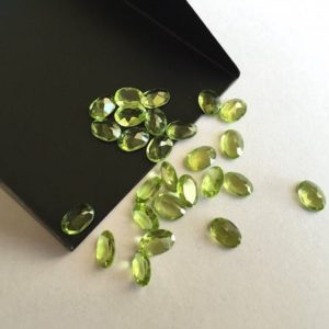 Shop Peridot Faceted Beads! 25 Pieces 7x5mm Peridot Faceted Oval Shaped Green Color Loose Gemstones SKU-P4 | Natural genuine faceted Peridot beads for beading and jewelry making.  #jewelry #beads #beadedjewelry #diyjewelry #jewelrymaking #beadstore #beading #affiliate #ad