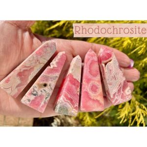 Shop Rhodochrosite Stones & Crystals! Rhodochrosite Mini Crystal Points, Obelisk Towers, Rhodochrosite, Self-Standing, Argentina Rhodochrosite, For Heart Chakra Healing | Natural genuine stones & crystals in various shapes & sizes. Buy raw cut, tumbled, or polished gemstones for making jewelry or crystal healing energy vibration raising reiki stones. #crystals #gemstones #crystalhealing #crystalsandgemstones #energyhealing #affiliate #ad