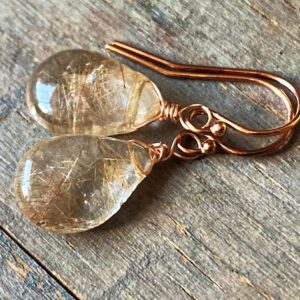 Shop Rutilated Quartz Jewelry! Golden Rutilated Quartz Earrings, smooth petite rutile Quartz dangles. Gold drops. Yellow. Gemstone earrings. Leverbacks. | Natural genuine Rutilated Quartz jewelry. Buy crystal jewelry, handmade handcrafted artisan jewelry for women.  Unique handmade gift ideas. #jewelry #beadedjewelry #beadedjewelry #gift #shopping #handmadejewelry #fashion #style #product #jewelry #affiliate #ad
