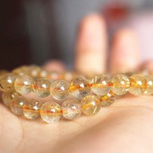 Shop Rutilated Quartz Round Beads! Natural Gold Rutile Quartz Round Beads,4mm/6mm/8mm/10mm/12mm/ Rutile Quartz Beads,15 inches one starand | Natural genuine round Rutilated Quartz beads for beading and jewelry making.  #jewelry #beads #beadedjewelry #diyjewelry #jewelrymaking #beadstore #beading #affiliate #ad