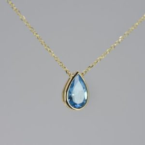 Shop Topaz Necklaces! BLUE TOPAZ BEZEL Necklace, Anniversary gift for her, Gold blue topaz necklace, Birthday gift for wife, Pear shape necklace, Blue gemstone | Natural genuine Topaz necklaces. Buy crystal jewelry, handmade handcrafted artisan jewelry for women.  Unique handmade gift ideas. #jewelry #beadednecklaces #beadedjewelry #gift #shopping #handmadejewelry #fashion #style #product #necklaces #affiliate #ad