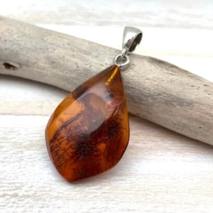 Shop Amber Pendants! Natural Amber Pendant // Cherry Whisky Amber Pendant // Smooth Amber Pendant // Natural Amber Freeform // 925 Sterling Silver | Natural genuine Amber pendants. Buy crystal jewelry, handmade handcrafted artisan jewelry for women.  Unique handmade gift ideas. #jewelry #beadedpendants #beadedjewelry #gift #shopping #handmadejewelry #fashion #style #product #pendants #affiliate #ad