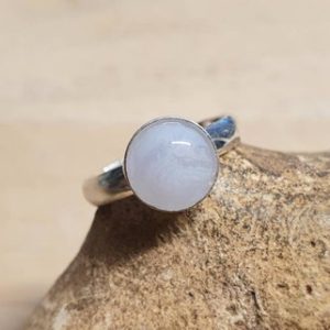 Shop Blue Lace Agate Rings! Minimalist Blue lace agate ring. 925 Sterling silver Adjustable ring. Reiki jewelry. Pisces jewelry. Women's Gemstone ring. 8mm stone | Natural genuine Blue Lace Agate rings, simple unique handcrafted gemstone rings. #rings #jewelry #shopping #gift #handmade #fashion #style #affiliate #ad