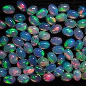 Shop Opal Cabochons! 10 pcs 4x6mm Ethiopian Opal Oval Cabochon Gemstone, Multi Fire Opal Oval Cabochon Quality 100% Natural Ethiopian Opal Oval Cabochon Gemstone | Natural genuine stones & crystals in various shapes & sizes. Buy raw cut, tumbled, or polished gemstones for making jewelry or crystal healing energy vibration raising reiki stones. #crystals #gemstones #crystalhealing #crystalsandgemstones #energyhealing #affiliate #ad
