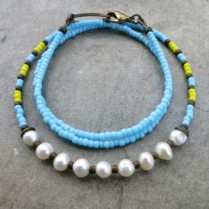 Shop Pearl Necklaces! Bright Bohemian Pearl Necklace with freshwater pearls, light blue seed beads and yellow accents | Natural genuine Pearl necklaces. Buy crystal jewelry, handmade handcrafted artisan jewelry for women.  Unique handmade gift ideas. #jewelry #beadednecklaces #beadedjewelry #gift #shopping #handmadejewelry #fashion #style #product #necklaces #affiliate #ad