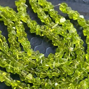 Shop Peridot Chip & Nugget Beads! Full strand of peridot chips small | Natural genuine chip Peridot beads for beading and jewelry making.  #jewelry #beads #beadedjewelry #diyjewelry #jewelrymaking #beadstore #beading #affiliate #ad