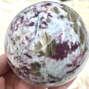 Shop Pink Tourmaline Stones & Crystals! Pink Tourmaline Rubellite Sphere 84mm HU | Natural genuine stones & crystals in various shapes & sizes. Buy raw cut, tumbled, or polished gemstones for making jewelry or crystal healing energy vibration raising reiki stones. #crystals #gemstones #crystalhealing #crystalsandgemstones #energyhealing #affiliate #ad