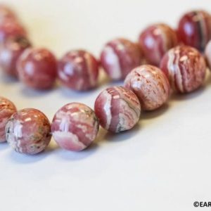Shop Rhodochrosite Round Beads! L/ Rhodochrosite 14mm Round beads 16" strand Argentina Natural pink banded gemstone beads For jewelry making | Natural genuine round Rhodochrosite beads for beading and jewelry making.  #jewelry #beads #beadedjewelry #diyjewelry #jewelrymaking #beadstore #beading #affiliate #ad
