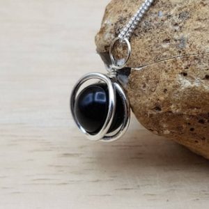 Shop Spinel Pendants! Small Black Spinel Circle Pendant Necklace. Reiki Jewelry. 10mm Stone. Sterling Silver 3d Round Frame Necklace. | Natural genuine Spinel pendants. Buy crystal jewelry, handmade handcrafted artisan jewelry for women.  Unique handmade gift ideas. #jewelry #beadedpendants #beadedjewelry #gift #shopping #handmadejewelry #fashion #style #product #pendants #affiliate #ad