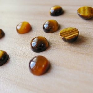 Shop Tiger Eye Stones & Crystals! Natural Tiger Eye Cabochon Yellow Tiger's Eye Cabochons Loose Gemstone Round 8mm Healing Crystal Wholesale High Quality | Natural genuine stones & crystals in various shapes & sizes. Buy raw cut, tumbled, or polished gemstones for making jewelry or crystal healing energy vibration raising reiki stones. #crystals #gemstones #crystalhealing #crystalsandgemstones #energyhealing #affiliate #ad