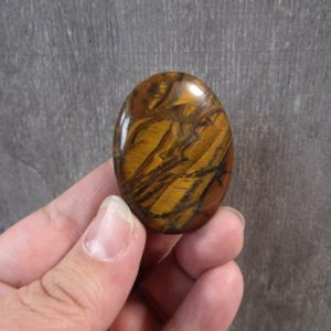 Shop Tiger Iron Stones & Crystals! Tiger Iron Flat Oval Palm Stone E58 | Natural genuine stones & crystals in various shapes & sizes. Buy raw cut, tumbled, or polished gemstones for making jewelry or crystal healing energy vibration raising reiki stones. #crystals #gemstones #crystalhealing #crystalsandgemstones #energyhealing #affiliate #ad