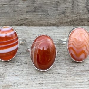 Shop Agate Rings! Choose Your Stone Orange Red Banded Agate Oval Sterling Silver Ring | Red Agate Ring | Swirly White Red Orange Stone Ring | Natural genuine Agate rings, simple unique handcrafted gemstone rings. #rings #jewelry #shopping #gift #handmade #fashion #style #affiliate #ad