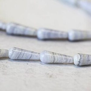 Shop Blue Lace Agate Bead Shapes! M/ Blue Lace Agate 6x16mm Teardrop Beads 16" Strand Natural Ice Blue Banded Agate Smooth Teardrop Cut For Crafts For All Jewelry Making | Natural genuine other-shape Blue Lace Agate beads for beading and jewelry making.  #jewelry #beads #beadedjewelry #diyjewelry #jewelrymaking #beadstore #beading #affiliate #ad
