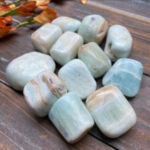 Shop Tumbled Calcite Crystals & Pocket Stones! Tumbled Caribbean Calcite Crystals | Natural genuine stones & crystals in various shapes & sizes. Buy raw cut, tumbled, or polished gemstones for making jewelry or crystal healing energy vibration raising reiki stones. #crystals #gemstones #crystalhealing #crystalsandgemstones #energyhealing #affiliate #ad