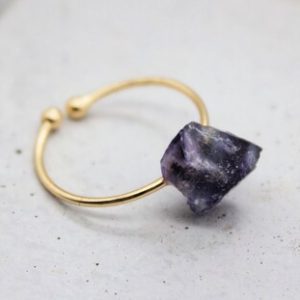 Shop Fluorite Rings! Raw Purple Fluorite Ring, Fluorite Crystal, Fluorite Stone Ring, Gold Ring, Crystal Ring, Fluorite Zodiac Birthday Gift, Aries April Taurus | Natural genuine Fluorite rings, simple unique handcrafted gemstone rings. #rings #jewelry #shopping #gift #handmade #fashion #style #affiliate #ad