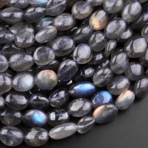Shop Labradorite Chip & Nugget Beads! Natural Black Labradorite Freeform Oval Pebble Nugget Beads 15.5" Strand | Natural genuine chip Labradorite beads for beading and jewelry making.  #jewelry #beads #beadedjewelry #diyjewelry #jewelrymaking #beadstore #beading #affiliate #ad