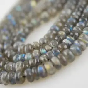 Shop Labradorite Rondelle Beads! 1/2 strand of smooth labradorite rondelles | Natural genuine rondelle Labradorite beads for beading and jewelry making.  #jewelry #beads #beadedjewelry #diyjewelry #jewelrymaking #beadstore #beading #affiliate #ad