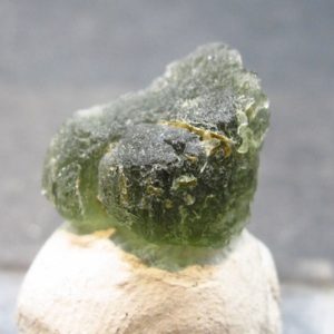 Shop Moldavite Stones & Crystals! Rare Moldavite Tektite Raw Piece From Czech Republic – 0.6" – 1.32 Grams | Natural genuine stones & crystals in various shapes & sizes. Buy raw cut, tumbled, or polished gemstones for making jewelry or crystal healing energy vibration raising reiki stones. #crystals #gemstones #crystalhealing #crystalsandgemstones #energyhealing #affiliate #ad