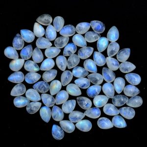 Shop Moonstone Cabochons! White Rainbow Blue Fire Moonstone 7x10mm Pear Smooth Cabochon | Natural Moonstone Semi Precious Gemstone Pear Loose Flat Back Cabochon Lot | Natural genuine stones & crystals in various shapes & sizes. Buy raw cut, tumbled, or polished gemstones for making jewelry or crystal healing energy vibration raising reiki stones. #crystals #gemstones #crystalhealing #crystalsandgemstones #energyhealing #affiliate #ad