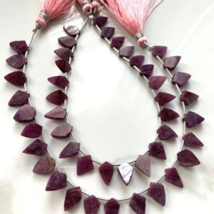 Shop Ruby Faceted Beads! 1/2 strand ruby bicone shaped slices | Natural genuine faceted Ruby beads for beading and jewelry making.  #jewelry #beads #beadedjewelry #diyjewelry #jewelrymaking #beadstore #beading #affiliate #ad