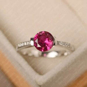 Red ruby ring, round cut, July birthstone ring, sterling silver, engagement ring for women | Natural genuine Array rings, simple unique alternative gemstone engagement rings. #rings #jewelry #bridal #wedding #jewelryaccessories #engagementrings #weddingideas #affiliate #ad
