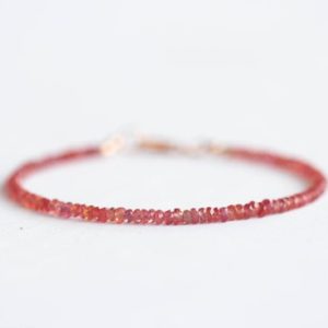 Shop Sapphire Jewelry! Padparadscha Sapphire Bracelet with Rose Gold Fill or Sterling Silver, Dainty Beaded Red Pink Orange Sapphire Jewelry | Natural genuine Sapphire jewelry. Buy crystal jewelry, handmade handcrafted artisan jewelry for women.  Unique handmade gift ideas. #jewelry #beadedjewelry #beadedjewelry #gift #shopping #handmadejewelry #fashion #style #product #jewelry #affiliate #ad