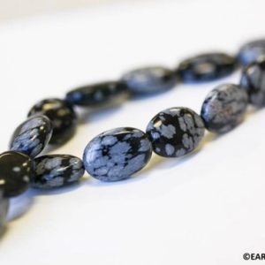 Shop Snowflake Obsidian Bead Shapes! M/ Snowflake Obsidian 10x14mm/ 13x18mm Flat Oval beads 16" strand Natural gray/black color gemstone beads For jewelry making | Natural genuine other-shape Snowflake Obsidian beads for beading and jewelry making.  #jewelry #beads #beadedjewelry #diyjewelry #jewelrymaking #beadstore #beading #affiliate #ad