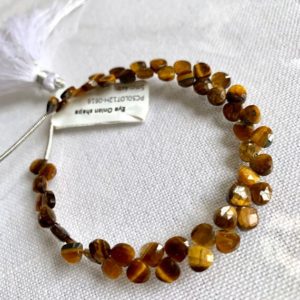 Shop Tiger Eye Faceted Beads! Beautiful tiger eye faceted mini hearts | Natural genuine faceted Tiger Eye beads for beading and jewelry making.  #jewelry #beads #beadedjewelry #diyjewelry #jewelrymaking #beadstore #beading #affiliate #ad