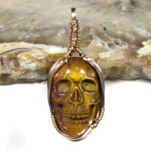 Shop Tiger Eye Pendants! Hand-carved Tiger Eye Gemstone Skull Pendant Wire Wrapped In 14k Rose Gold Filled Wire | Natural genuine Tiger Eye pendants. Buy crystal jewelry, handmade handcrafted artisan jewelry for women.  Unique handmade gift ideas. #jewelry #beadedpendants #beadedjewelry #gift #shopping #handmadejewelry #fashion #style #product #pendants #affiliate #ad