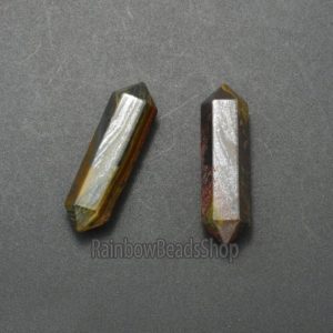 Shop Tiger Iron Pendants! Tiger Iron Eye Crystal Wand: Chakra Stone Beads for Reiki and Balance  Practices | Natural genuine Tiger Iron pendants. Buy crystal jewelry, handmade handcrafted artisan jewelry for women.  Unique handmade gift ideas. #jewelry #beadedpendants #beadedjewelry #gift #shopping #handmadejewelry #fashion #style #product #pendants #affiliate #ad